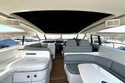 Interior of 2005 Princess V58 yacht, featuring sleek seating and modern design elements.
