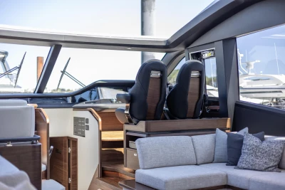 Luxurious interior of 2023 Princess S72 yacht with modern seating and sleek design.