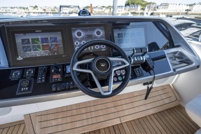Cockpit of 2023 Princess S72 yacht with advanced navigation displays and controls.