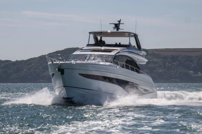 Luxurious 2023 Princess S72 yacht cruising on open water.