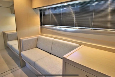 Interior of 2017 Princess V40 yacht with beige sofa and modern design.