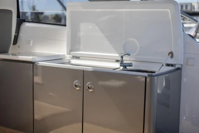 Modern kitchenette on a 2017 Princess V40 yacht with sleek cabinetry and sink.
