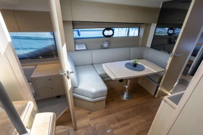 Luxurious interior of 2017 Princess V40 yacht with elegant seating and dining area.