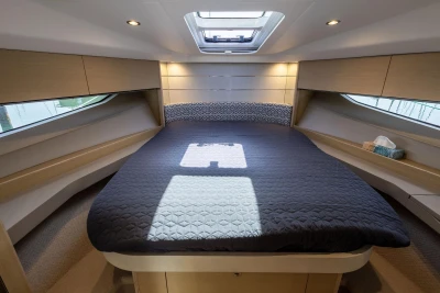 Luxurious 2017 Princess V40 yacht cabin with skylight and elegant bedding.