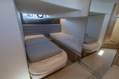 Luxurious interior cabin of 2017 Princess V40 yacht with twin beds and modern decor.