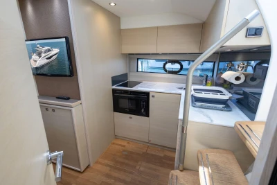 Modern kitchen interior of 2017 Princess V40 yacht with sleek design and appliances.