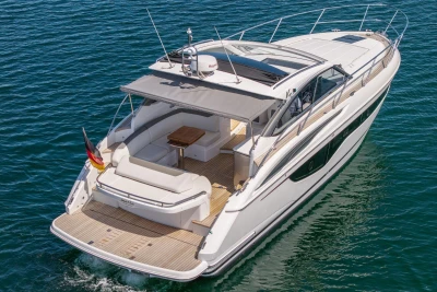 Luxurious 2017 Princess V40 yacht cruising on clear blue waters.