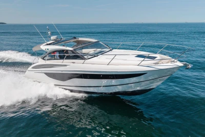 2017 Princess V40 yacht cruising on open sea under clear blue sky.