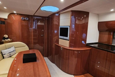 Luxurious 2006 Princess V48 yacht interior with polished wood finish and modern amenities.