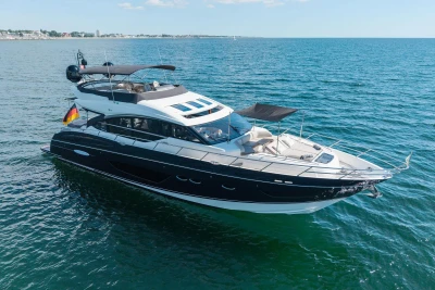 Luxurious 2014 Princess S72 yacht cruising on open water, featuring sleek design and spacious deck.
