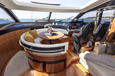 Luxurious interior of 2014 Princess S72 yacht with elegant seating and modern helm.