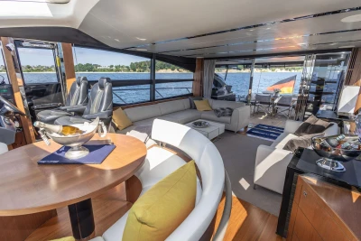 Luxurious interior of 2014 Princess S72 yacht with elegant seating and scenic water views.
