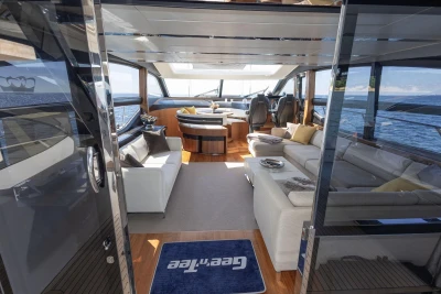 Luxurious interior of 2014 Princess S72 yacht with modern seating and ocean view.