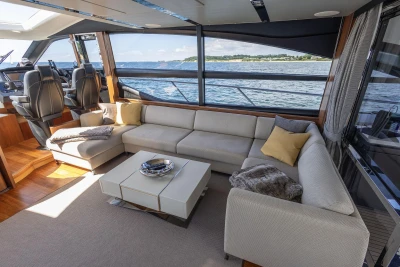 Luxurious interior of 2014 Princess S72 yacht with elegant seating and scenic ocean view.
