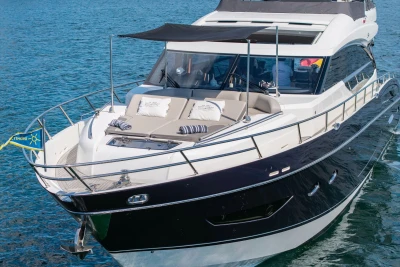 Luxurious 2014 Princess S72 yacht cruising on clear blue waters.
