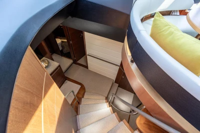 Interior view of 2014 Princess S72 yacht, featuring elegant staircase and modern design.