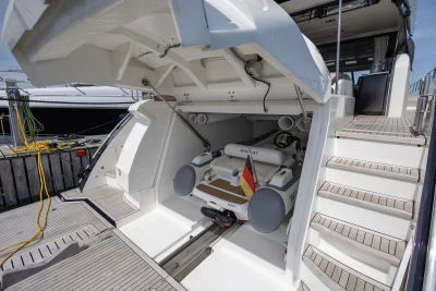 2014 Princess S72 yacht with open garage, revealing a stored tender boat.