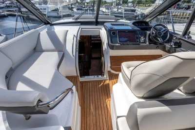 Luxurious interior of 2015 Princess V48 Open yacht with modern helm and seating.