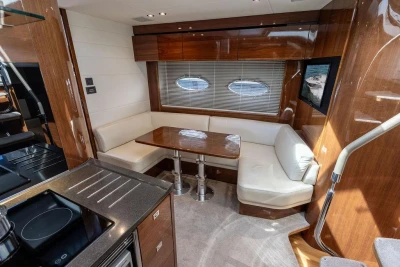 Luxurious interior of 2015 Princess V48 Open yacht with elegant seating and dining area.
