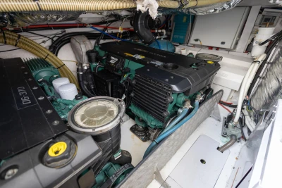 Engine room of a 2015 Princess V39 yacht, showcasing dual Volvo Penta engines.