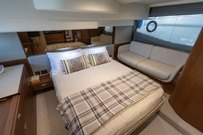 Luxurious bedroom interior of 2024 Princess F50 yacht with elegant furnishings and modern design.