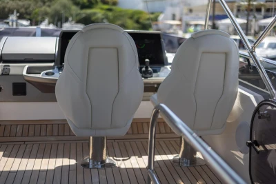 Luxury yacht cockpit with two white seats, Princess F50 2024 model.