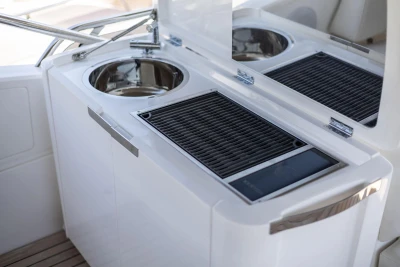 Outdoor kitchen on 2024 Princess F50 yacht with grill and sink.