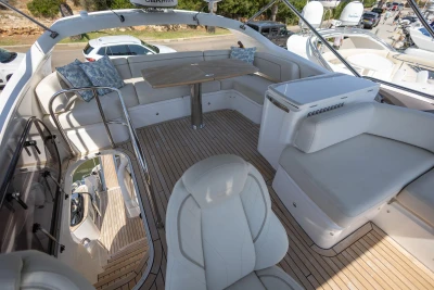 Luxurious 2024 Princess F50 yacht deck with elegant seating and wooden flooring.