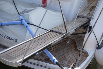 Luxury yacht Princess F50, 2024 model, featuring a sleek gangway and teak deck.