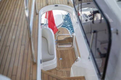 2025 Princess F65 yacht deck with teak flooring and elegant seating.