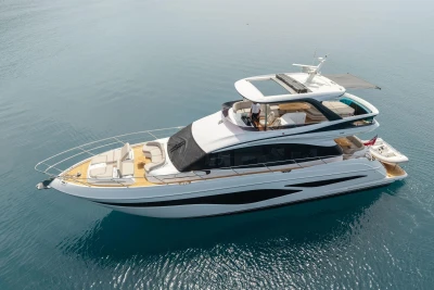 Luxurious 2025 Princess F65 yacht cruising on serene blue waters.