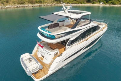 Luxury Princess F65 yacht, 2025 model, cruising in clear blue waters.