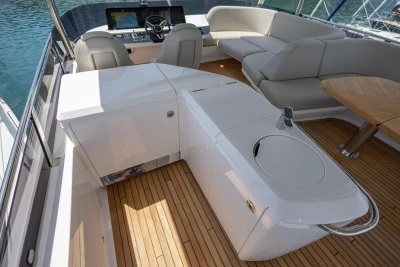 Luxurious 2025 Princess F65 yacht interior with sleek seating and modern helm station.