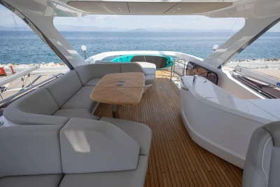 Luxurious 2025 Princess F65 yacht interior with elegant seating and ocean view.