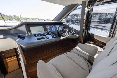 Luxurious 2026 Princess Y72 yacht cockpit with advanced navigation system and plush seating.