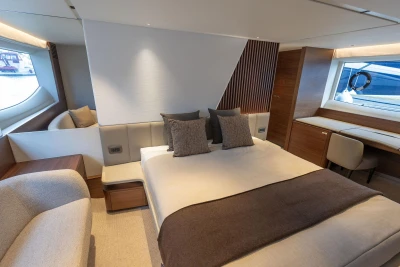 Luxurious interior of 2026 Princess Y72 yacht with elegant bedroom design.