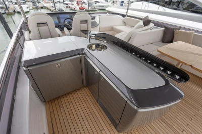 Luxurious 2026 Princess Y72 yacht interior with sleek kitchen and seating area.