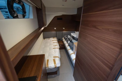 Luxurious cabin interior of 2026 Princess Y72 yacht with wooden finishes.