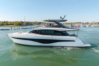 Luxury Princess Y72 yacht cruising in a serene marina, 2026 model.