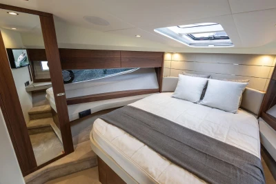 Luxurious interior of 2026 Princess V40 yacht with elegant bedroom design.