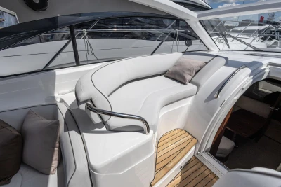 Luxurious seating area on 2026 Princess V40 yacht with sleek design and plush cushions.