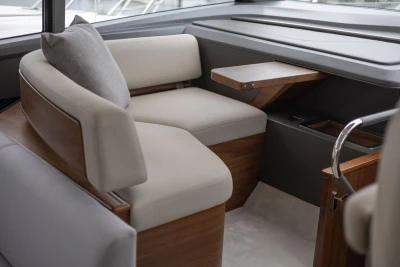 Luxurious interior of 2026 Princess F65 yacht with elegant seating and wooden accents.