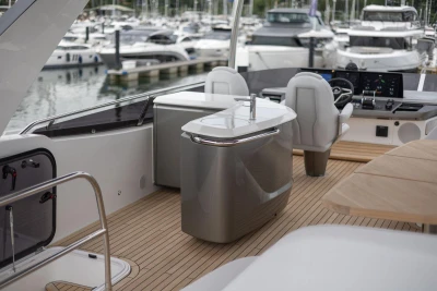 Luxurious 2026 Princess F65 yacht interior with modern helm and sleek design at marina.