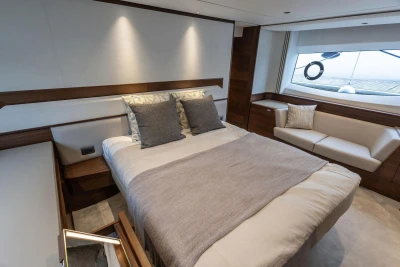 Luxurious bedroom interior of 2026 Princess F65 yacht with modern design and elegant furnishings.