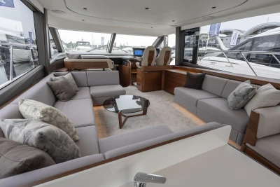 Luxurious interior of 2026 Princess F65 yacht with modern seating and elegant decor.