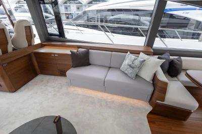 Luxurious interior of 2026 Princess F65 yacht with elegant seating and modern design.