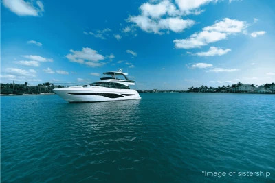 Luxurious 2026 Princess F65 yacht cruising on a serene blue sea under a clear sky.