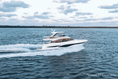 2026 Princess F65 yacht cruising on open water under a cloudy sky.