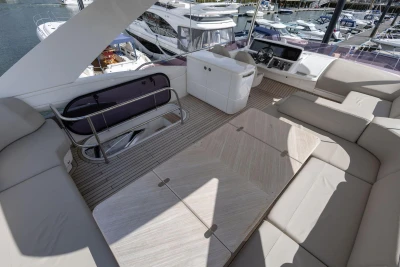 Luxurious 2020 Princess F55 yacht interior with spacious seating and modern helm.