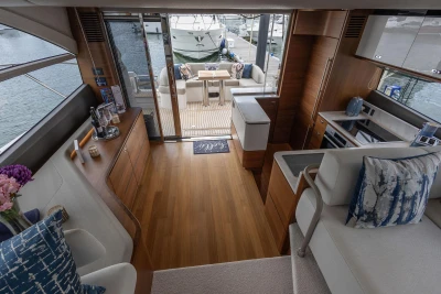 Luxurious interior of 2020 Princess F55 yacht with elegant wood flooring and modern amenities.